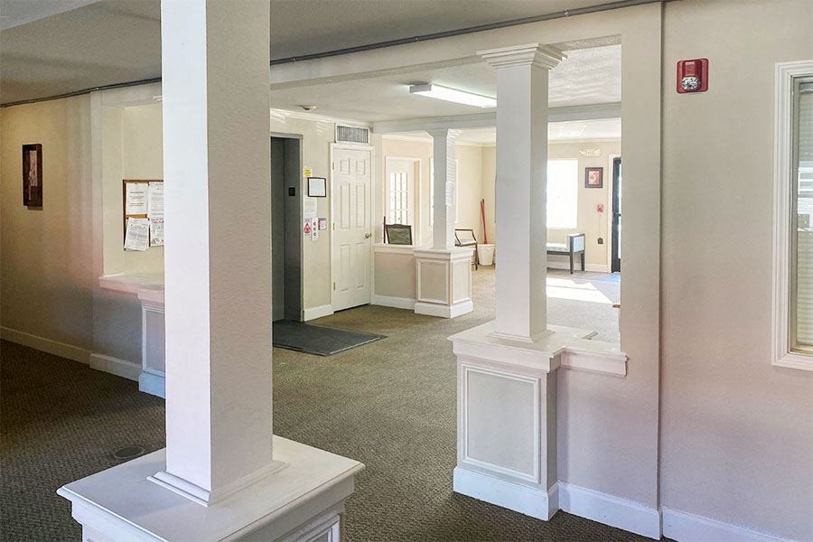 a large room with columns in the middle of it