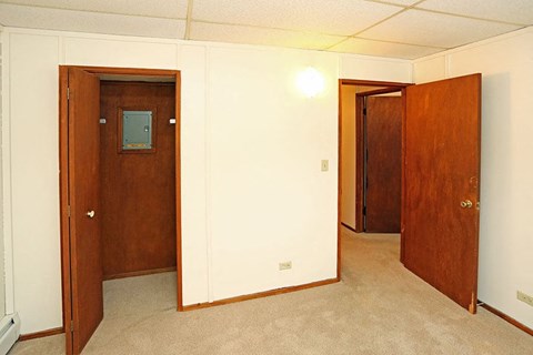 A room with two doors, one of which is open.