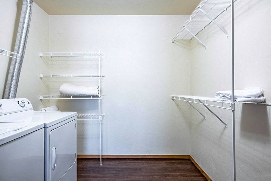 a small laundry room with a washer and dryer