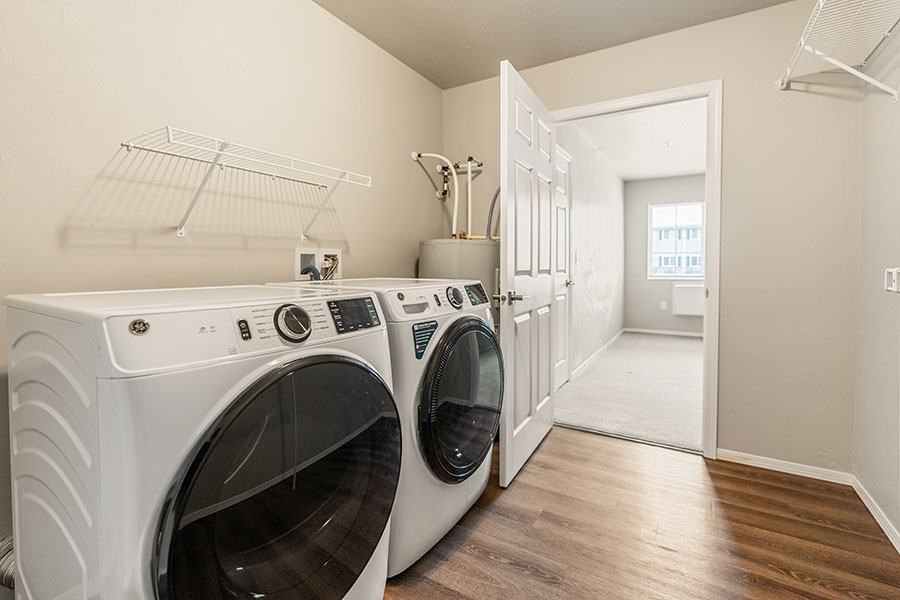 an aerial view of a community with a pond