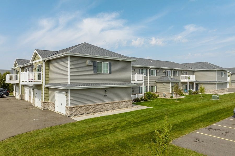a row of houses on the side of a street