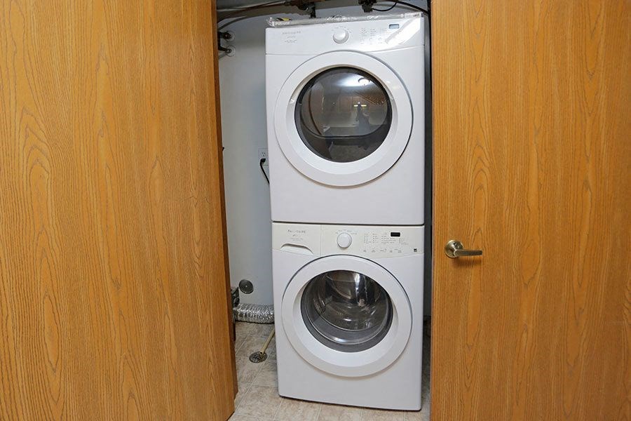 a white washer and dryer in a door