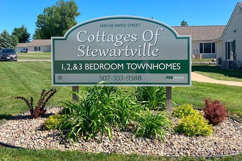 a sign for the contractors in the front yard of a house
