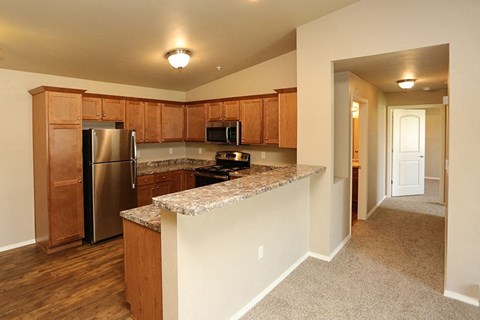 a kitchen with a counter top and a refrigerator