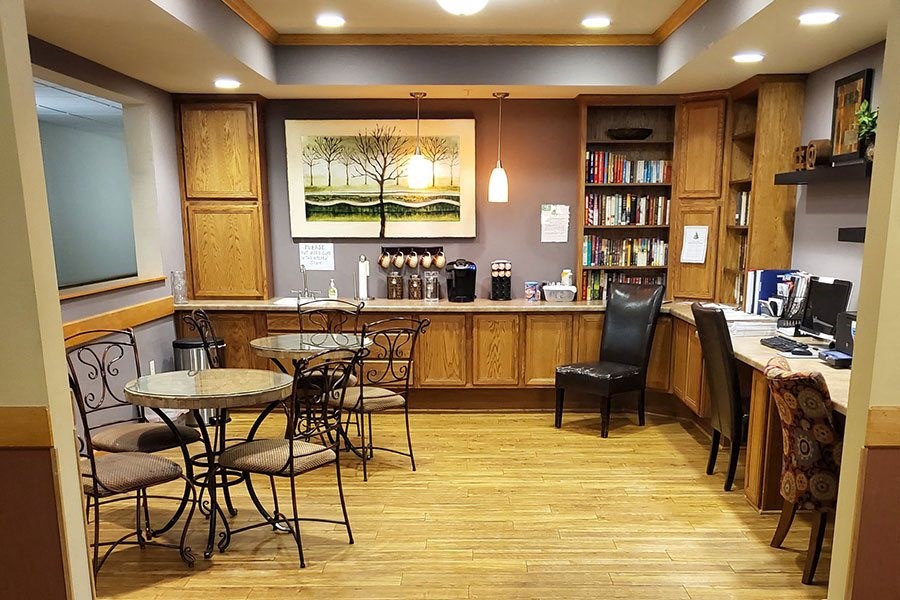 a restaurant with a bar and tables and chairs