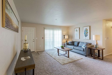 a living room with a couch and a table