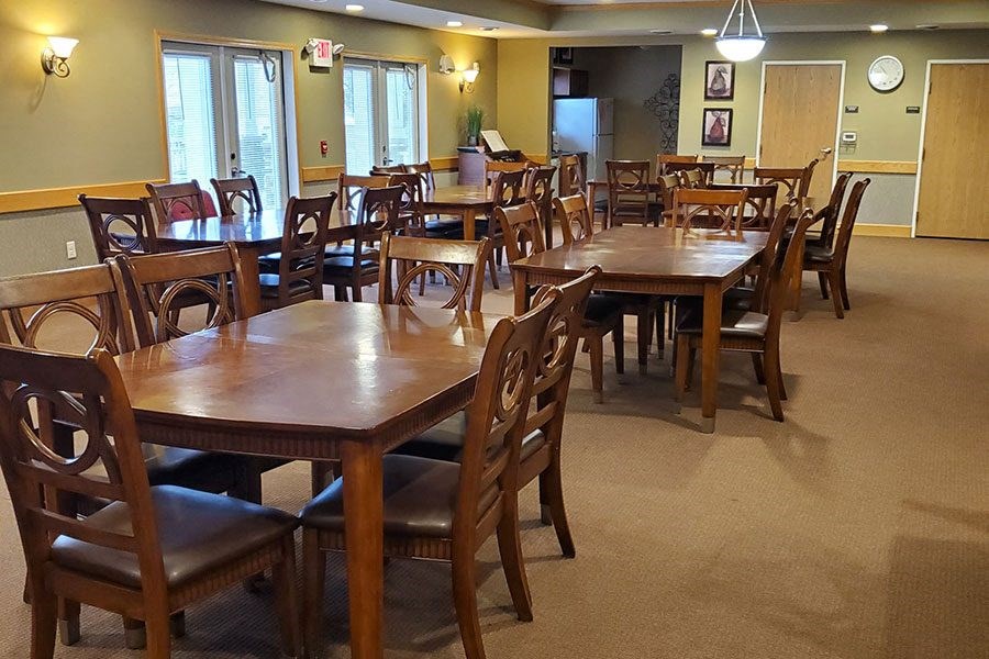 a large dining room with many tables and chairs