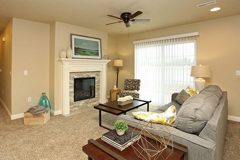 a living room with a couch and a fireplace
