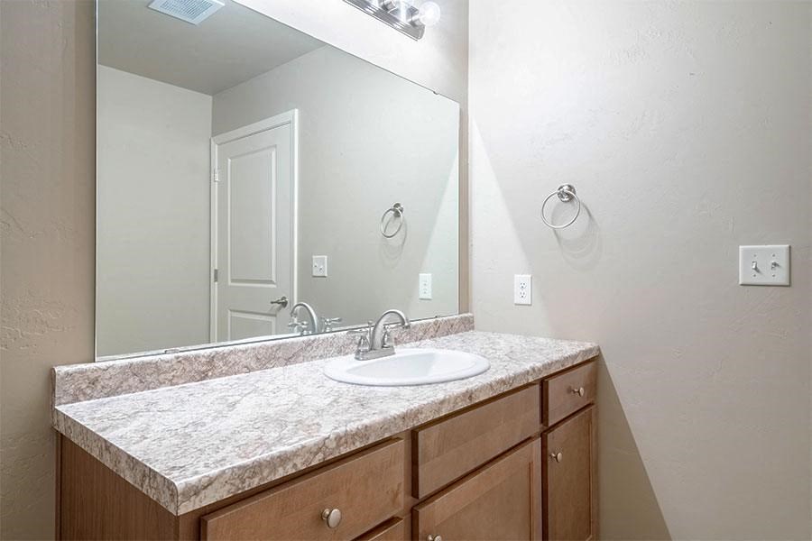 a bathroom with a sink and a mirror