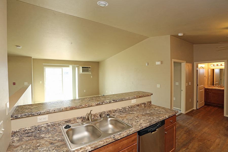 a kitchen with a granite counter top and a sink