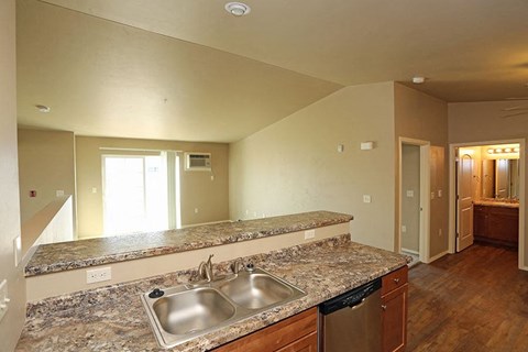 a kitchen with a granite counter top and a sink