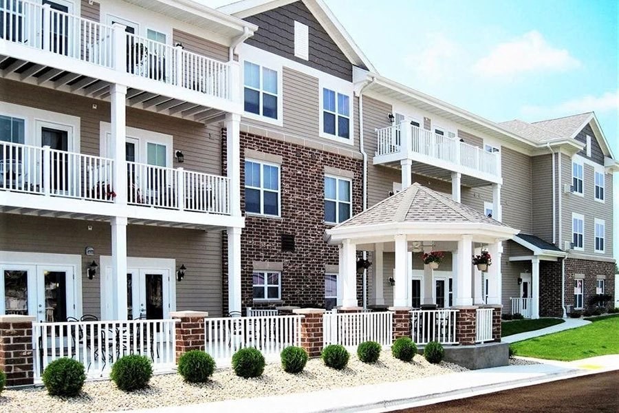 an apartment building with a porch and balconies