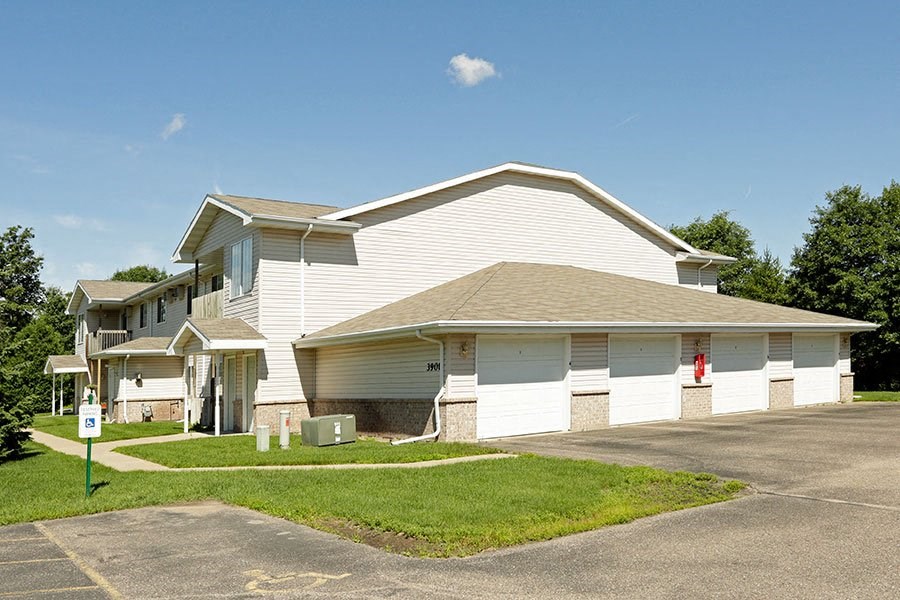 a white house with a lawn in front of it