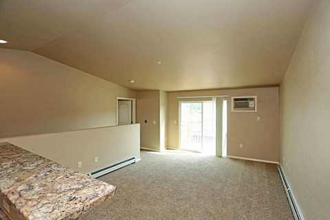 an empty room with a bed and a door