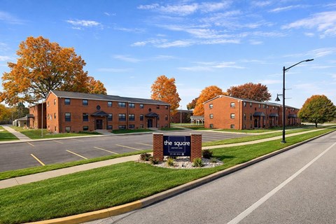 The Square is a red brick building with a parking lot in front.