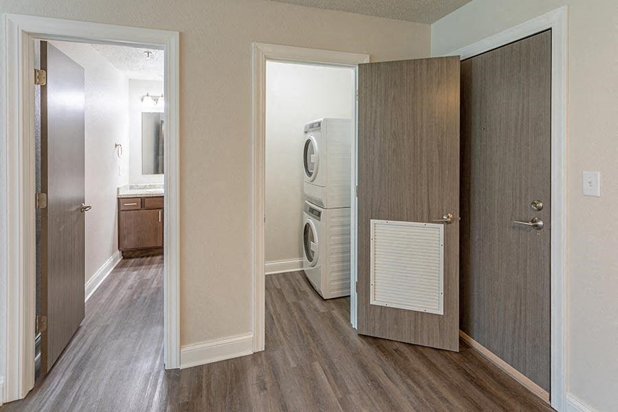 a room with a washing machine and a dryer in it