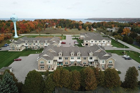 an aerial view of a large building with a water tower