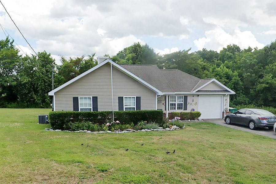 a house with a car parked in front of it