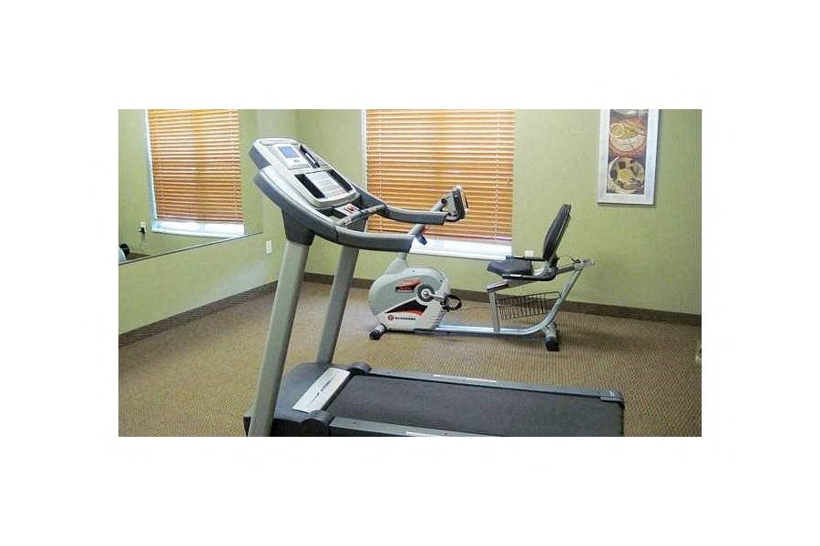 a treadmill in the corner of a room
