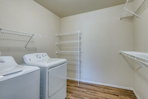 A laundry room with a washer and dryer.