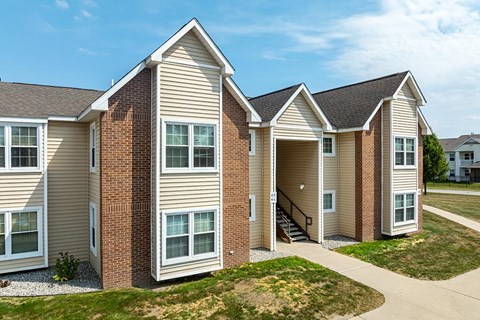 A modern two-story house with a garage on the first floor.