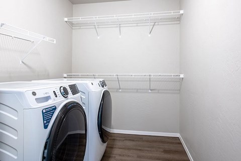 A laundry room with a washer and dryer.