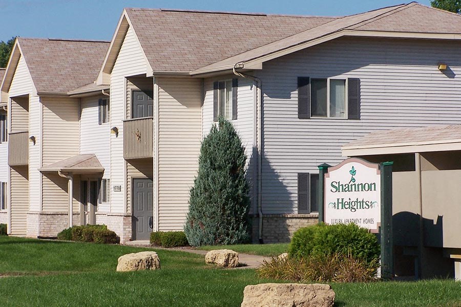 a white building with a sign in front of it