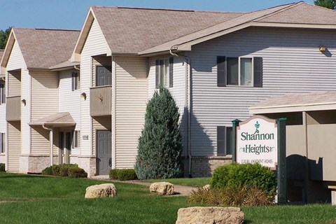 a white building with a sign in front of it