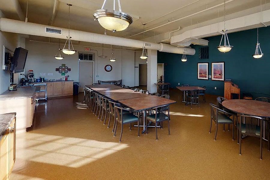 a large room with tables and chairs in it