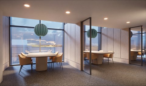 A conference room with a table and chairs and a view of the outside.