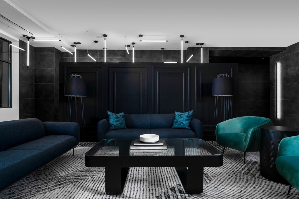a living room with blue couches and a coffee table