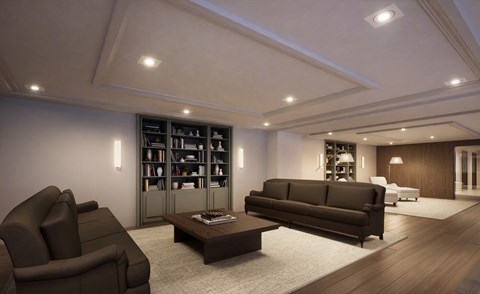 A modern living room with a dark brown sofa and a coffee table.