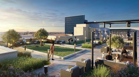 A modern outdoor seating area with people enjoying the view.