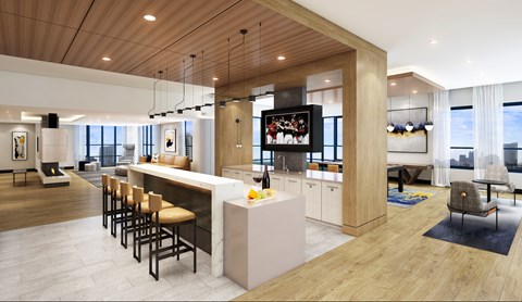 A modern kitchen with a bar area and a view of the city.
