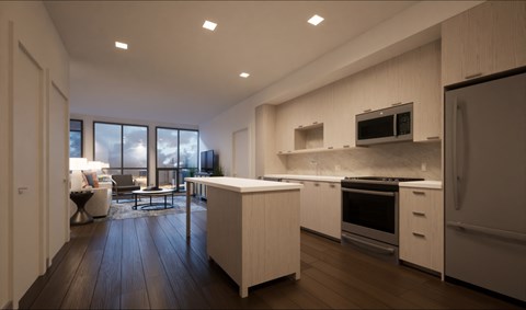A modern kitchen with white cabinets and appliances, a wooden floor, and a large window with a view of the sky.