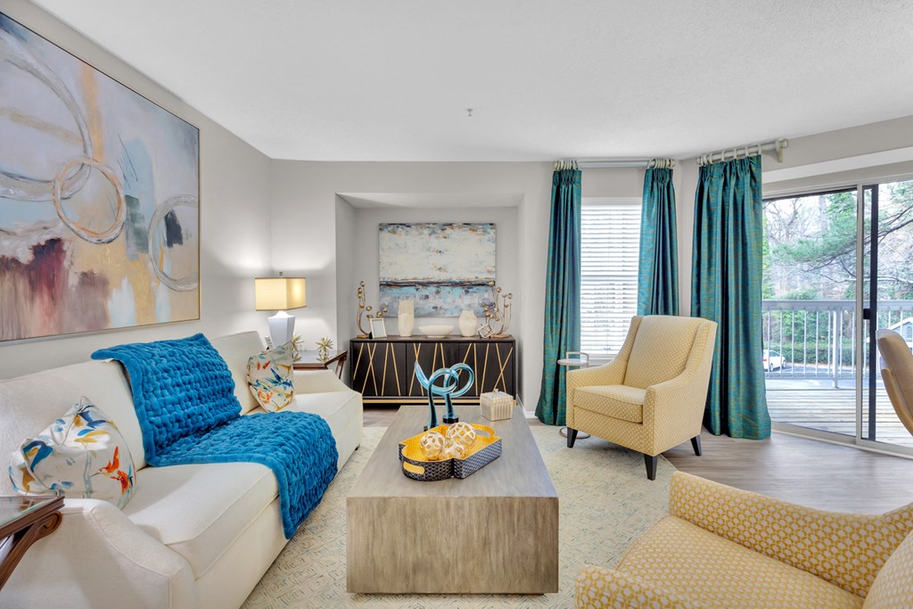a living room with a white couch and a coffee table