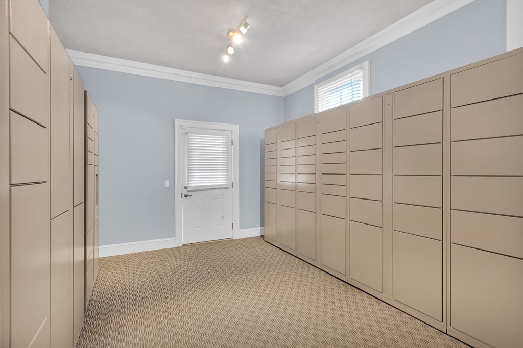 the laundry room has plenty of closets and a door to the courtyard