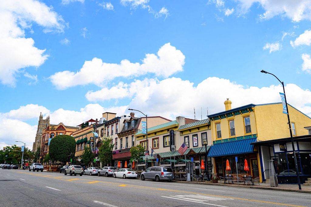 a city street with cars parked in front of buildings at Madison West Elm, Pennsylvania, 19428