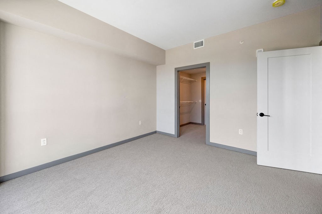 a bedroom with a closet and a door to a bathroom at Madison West Elm, Pennsylvania