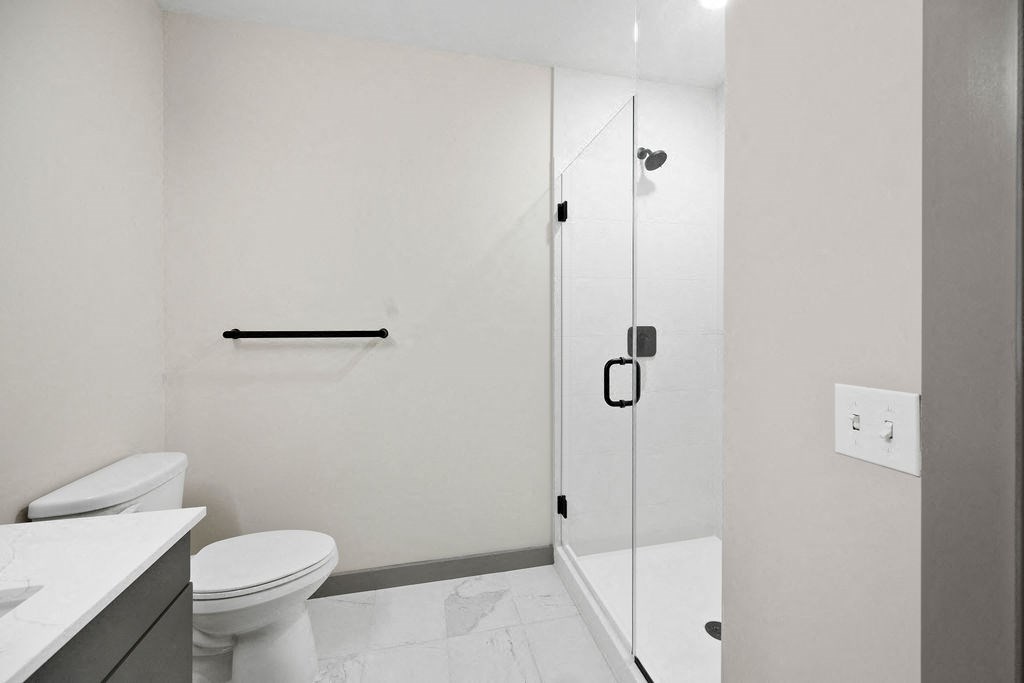 a bathroom with a toilet and a shower at Madison West Elm, Pennsylvania