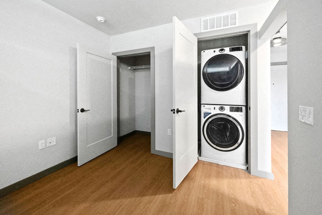a small laundry room with a washing machine in a door at Madison West Elm, Conshohocken