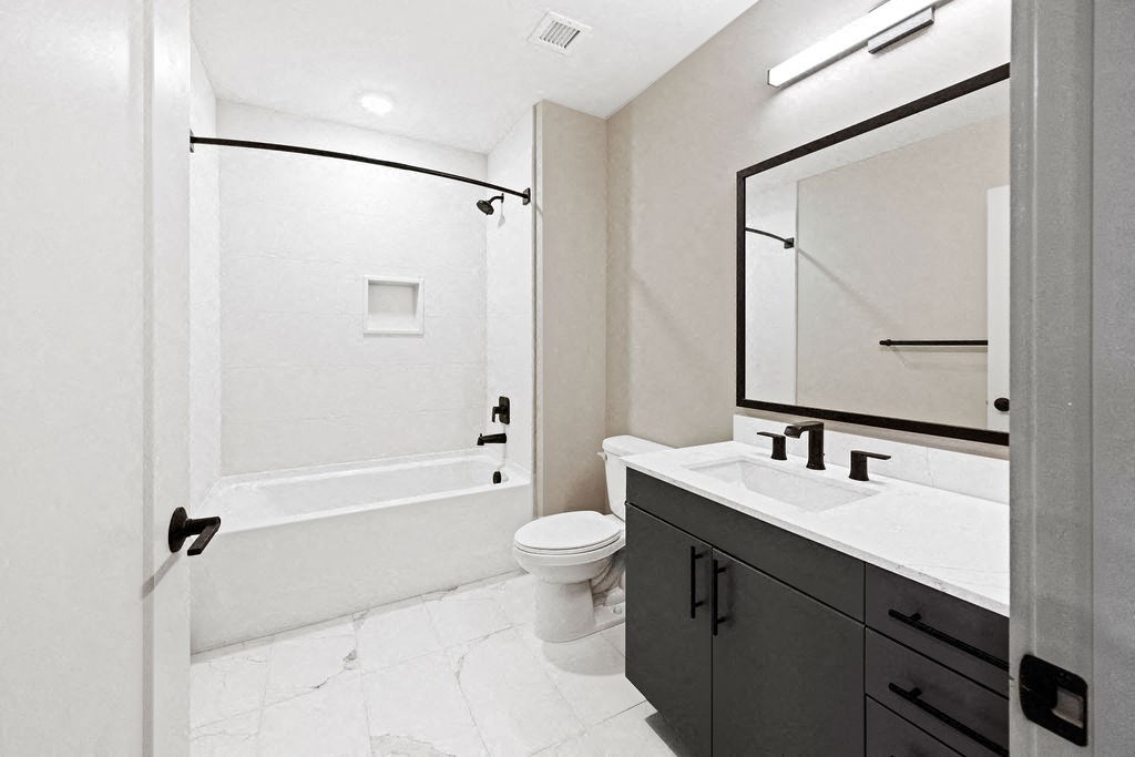 a bathroom with a sink toilet and a shower at Madison West Elm, Conshohocken