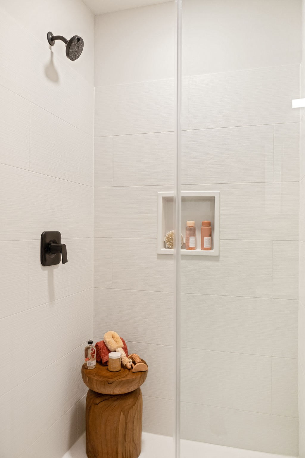 a small bathroom with a shower and a stool at Madison West Elm, Conshohocken, PA, 19428