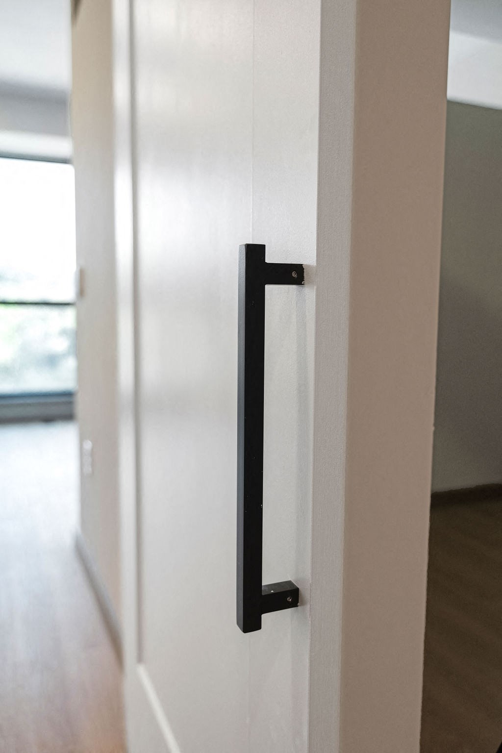 a white door with a black handle on it at Madison West Elm, Conshohocken, Pennsylvania