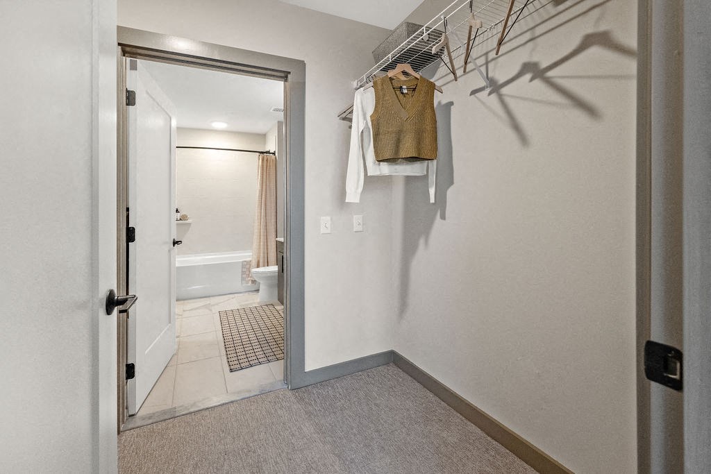 a bathroom with a shower and a door to a closet at Madison West Elm, Pennsylvania, 19428