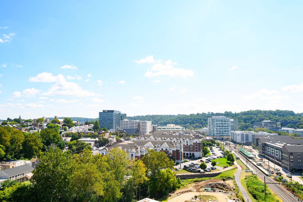 an aerial view of a city with buildings and trees at Madison West Elm, Conshohocken, PA, 19428