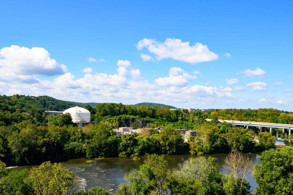 reflection of trees and clouds in the water at Madison West Elm, Conshohocken
