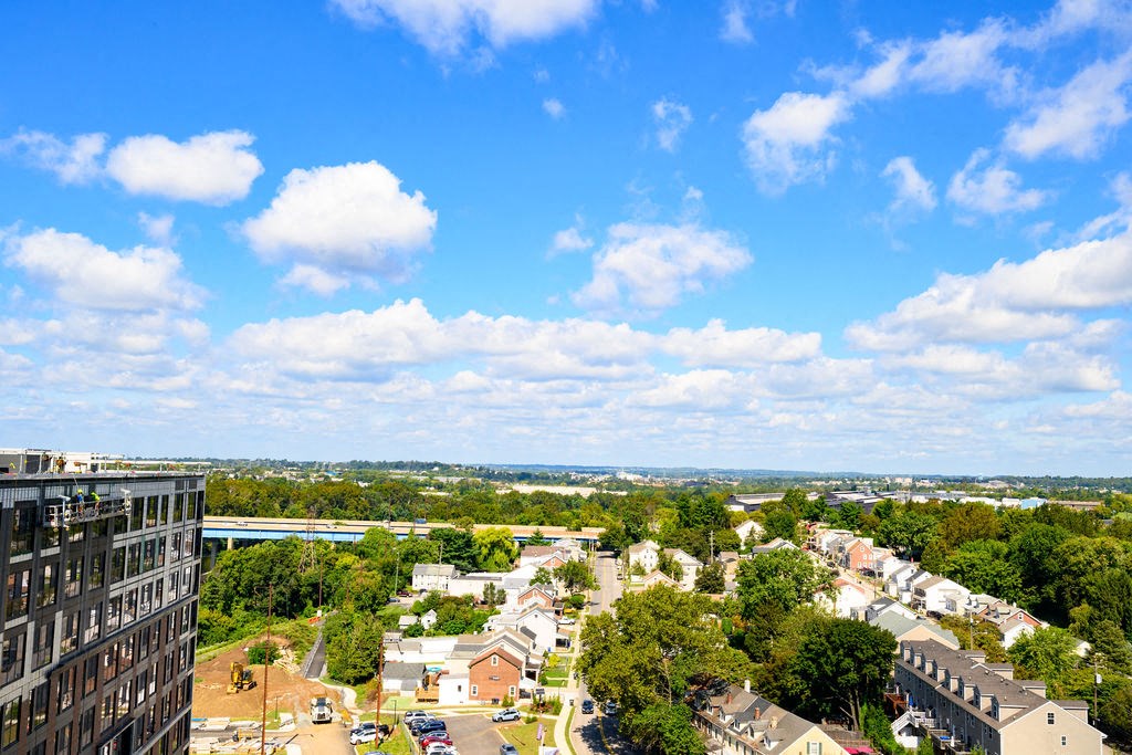an aerial view of a city with trees and buildings at Madison West Elm, Conshohocken, Pennsylvania