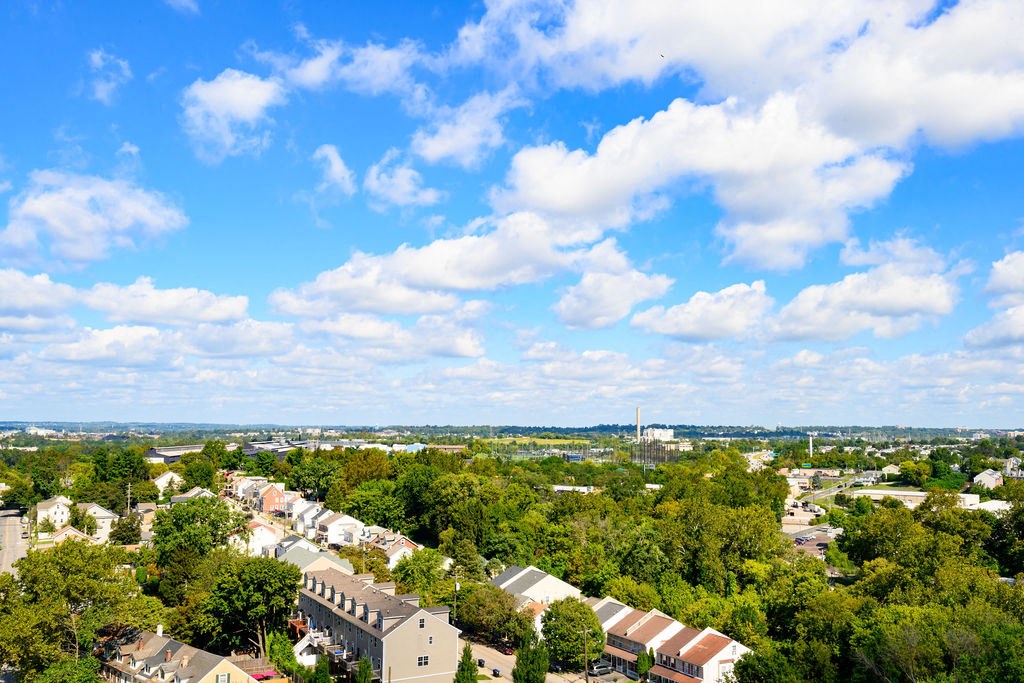 an aerial view of a city with trees and houses at Madison West Elm, Conshohocken, Pennsylvania