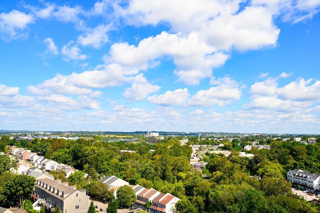 an aerial view of a city with trees and buildings at Madison West Elm, Conshohocken, PA
